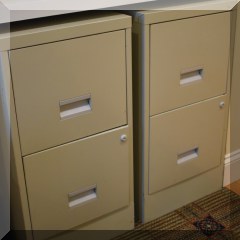 F32. 2 Metal file cabinets.